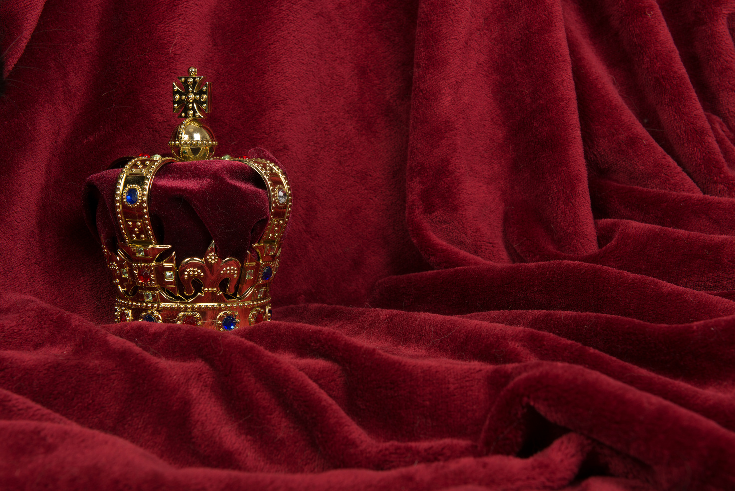 Royal Crown on a Red Velvet Background