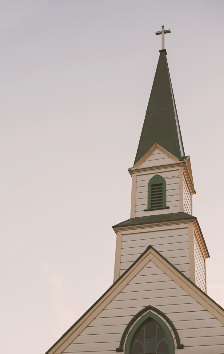 Architectural Photography of White and Green Church Bell Tower Under Clear Sky