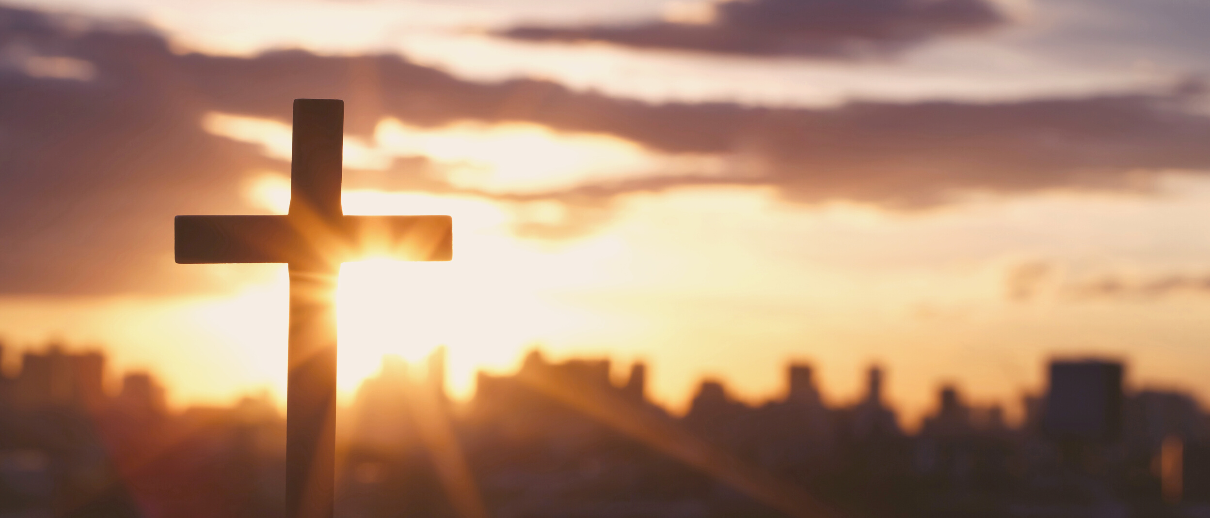 Silhouette of a Cross at Sunset